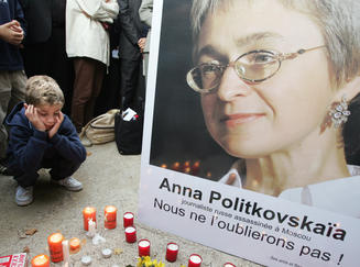 Mourners honoring Anna Politkovskaya, Russian journalist and regime critic, assassinated October 7, 2006